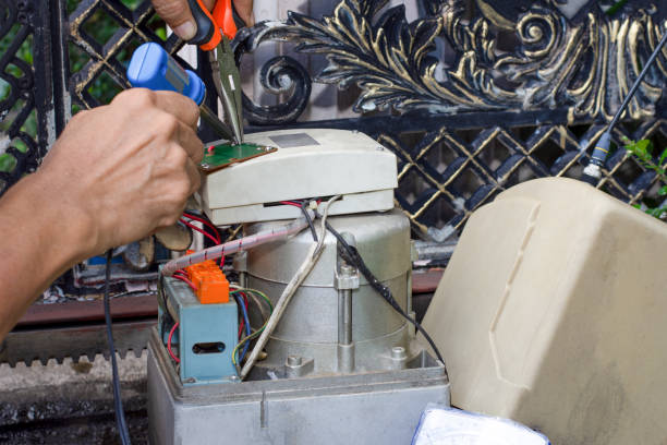 Technician man hand holding and using soldering iron to test and check the functional of the motor gear of remote control of auto door  Maintenance concept.